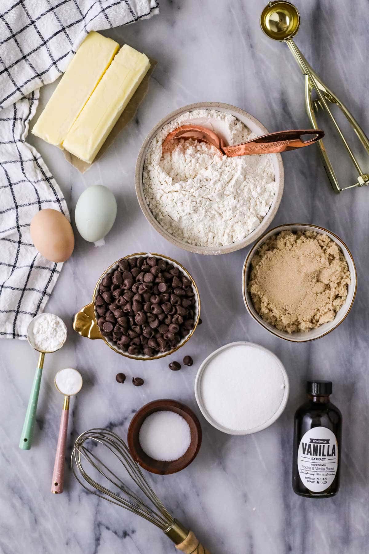 Overhead view of ingredients including chocolate chips, brown sugar, and more.