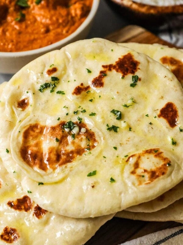 Pile of homemade naan including garlic naan.