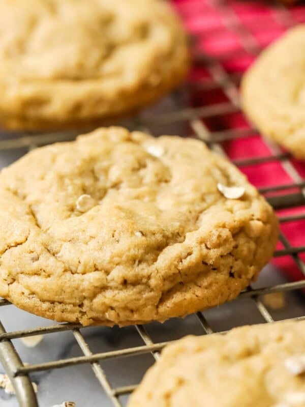 Peanut butter oatmeal cookies cooling on a gold cooling rack