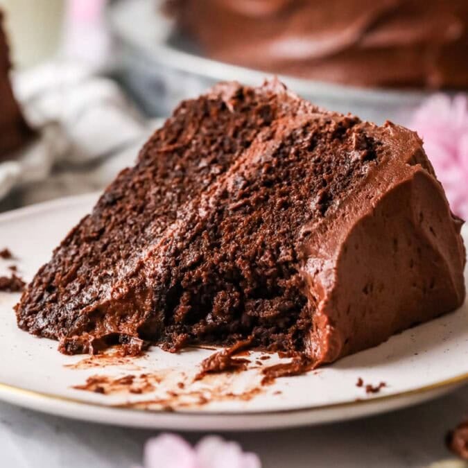 Slice of sourdough chocolate cake with a bite missing.
