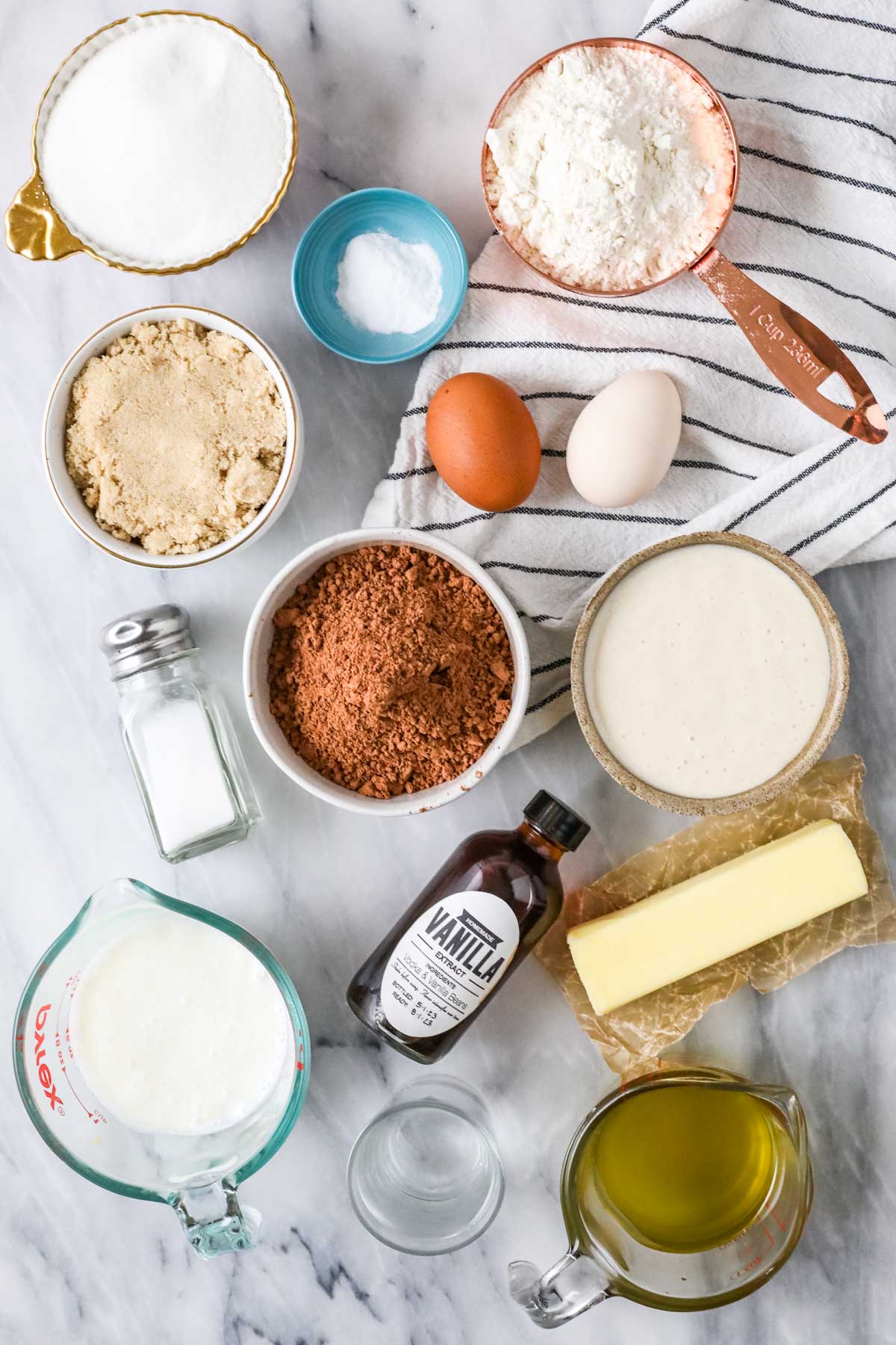 Overhead view of ingredients including cocoa powder, sourdough discard, buttermilk, and more.