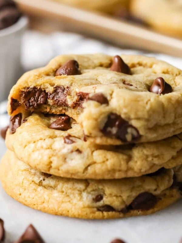 Stack of three chocolate chip cookies made from the best chocolate chip cookies recipe.
