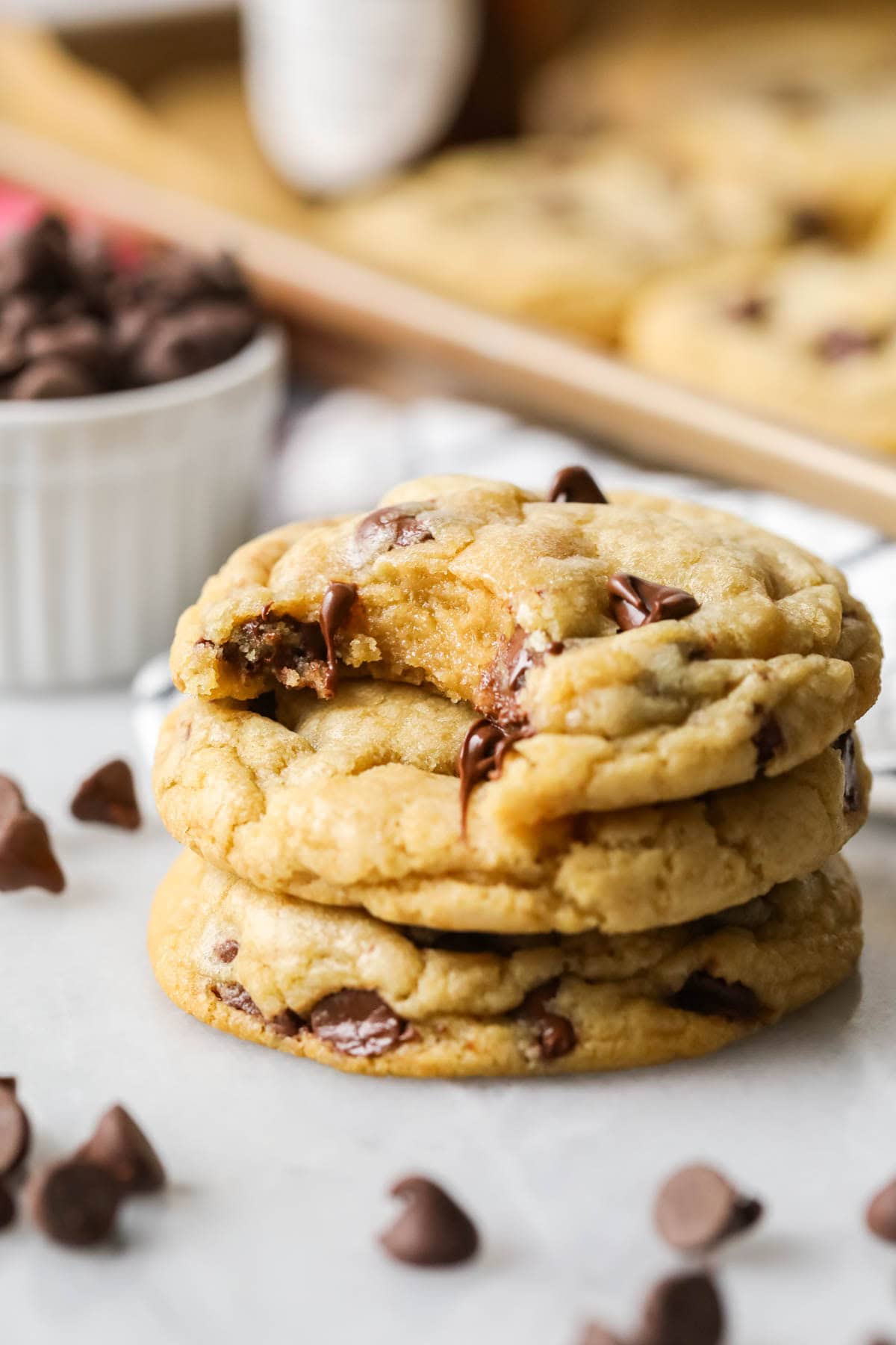 Stack of three chocolate chip cookies made from the best chocolate chip cookies recipe.