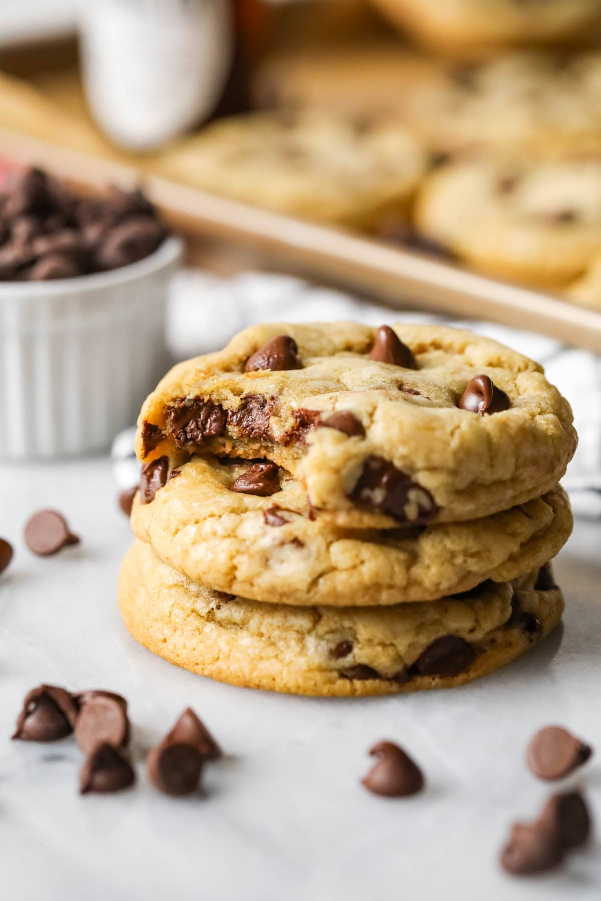 Stack of three chocolate chip cookies made from the best chocolate chip cookies recipe.