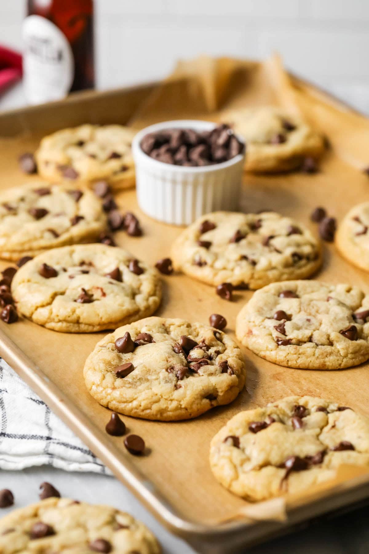 Baking sheet of cookies made with chocolate chips.