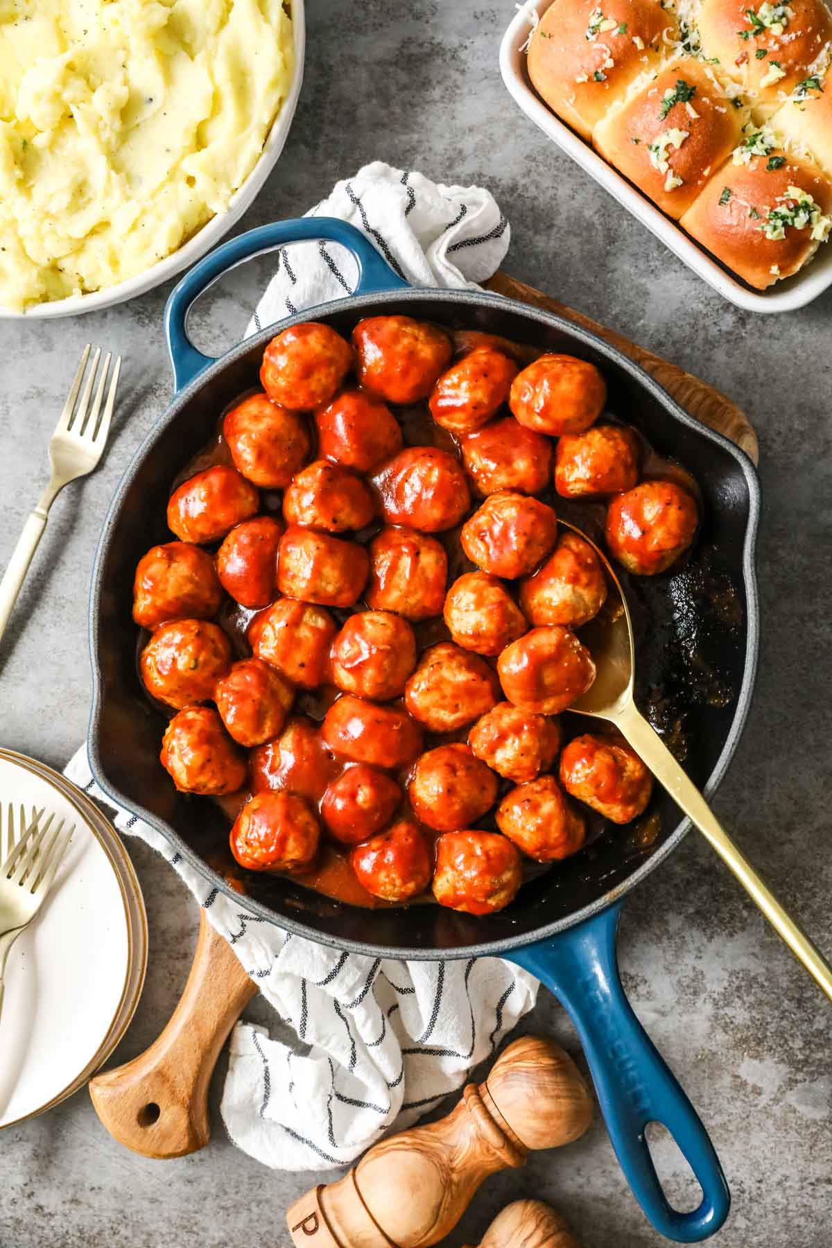 Overhead view of BBQ chicken meatballs in a skillet.