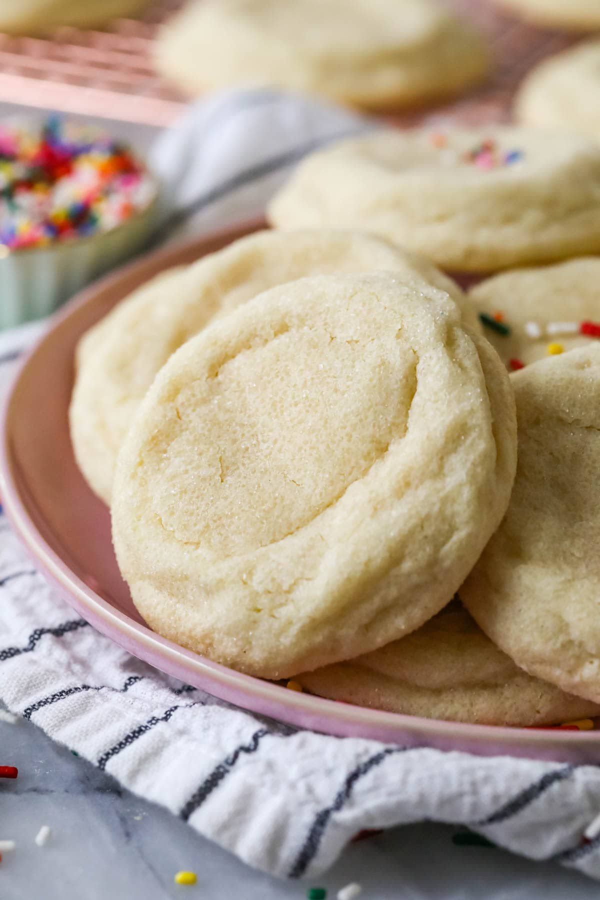 Thick and soft gourmet sugar cookies that have been rolled in sugar before baking.