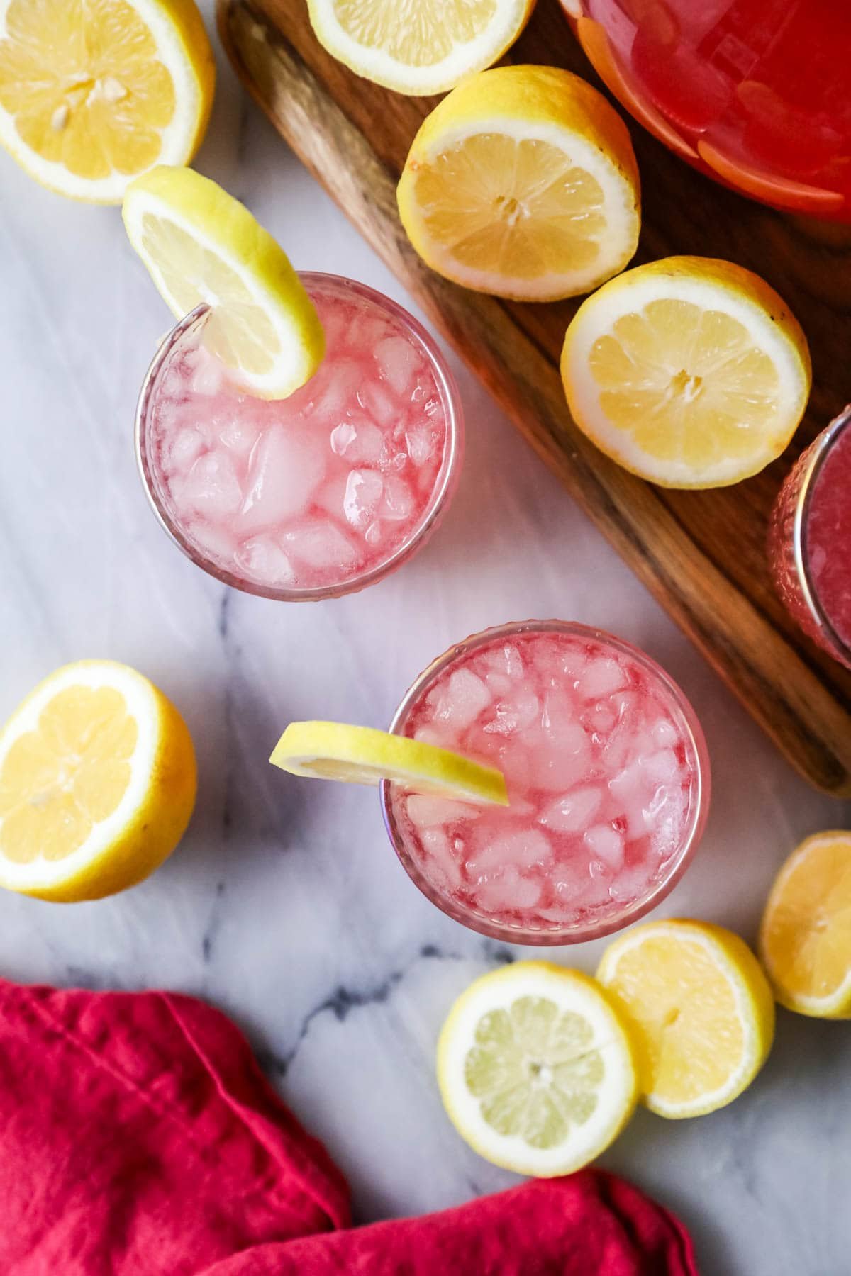 Top view of pink lemonade wearing sliced lemon.