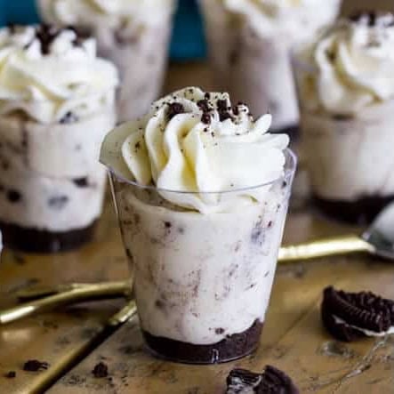 Oreo cheesecake dessert shooters in mini shot glasses.