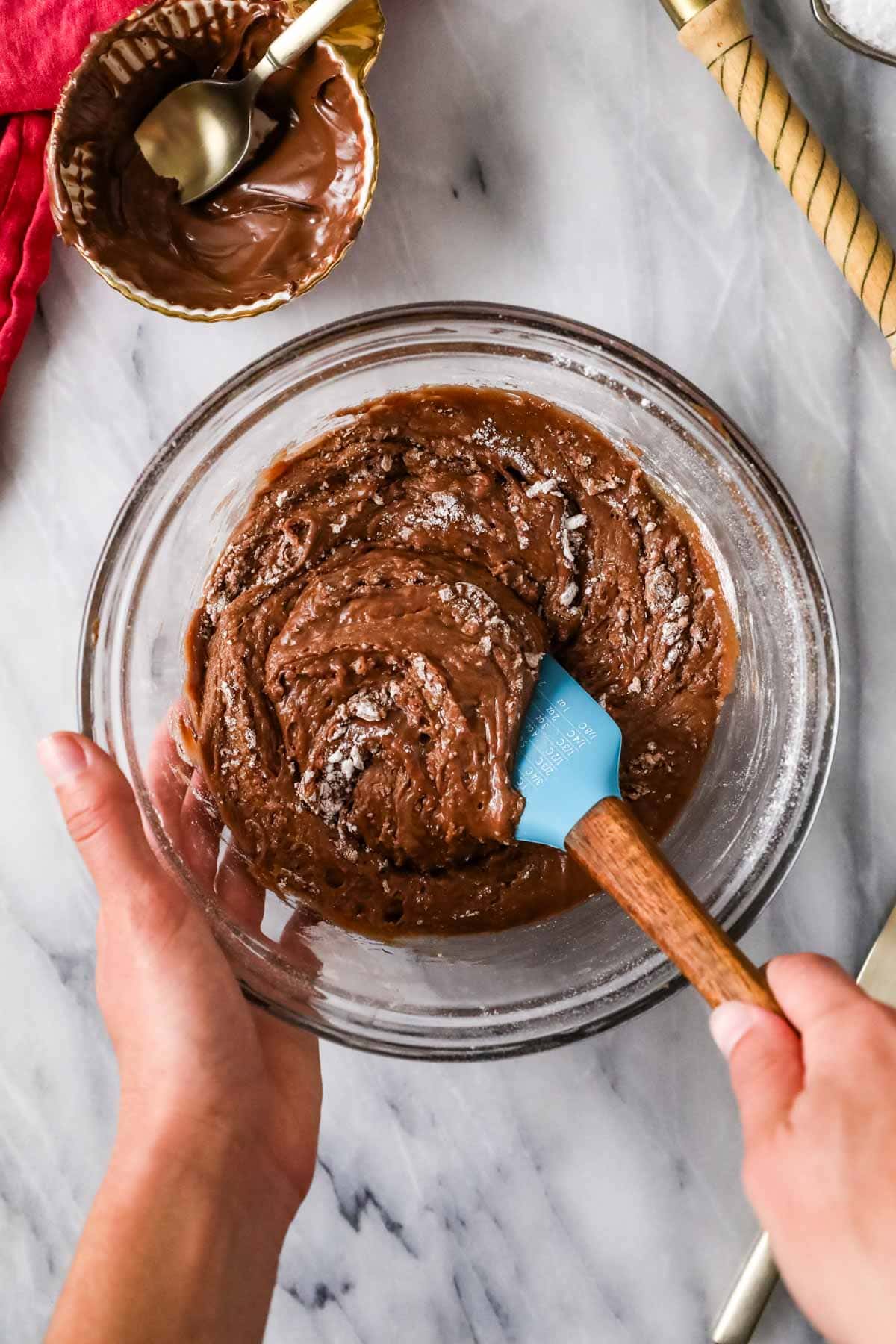 Overhead view of a bowl of brownie batter made with Nutella.