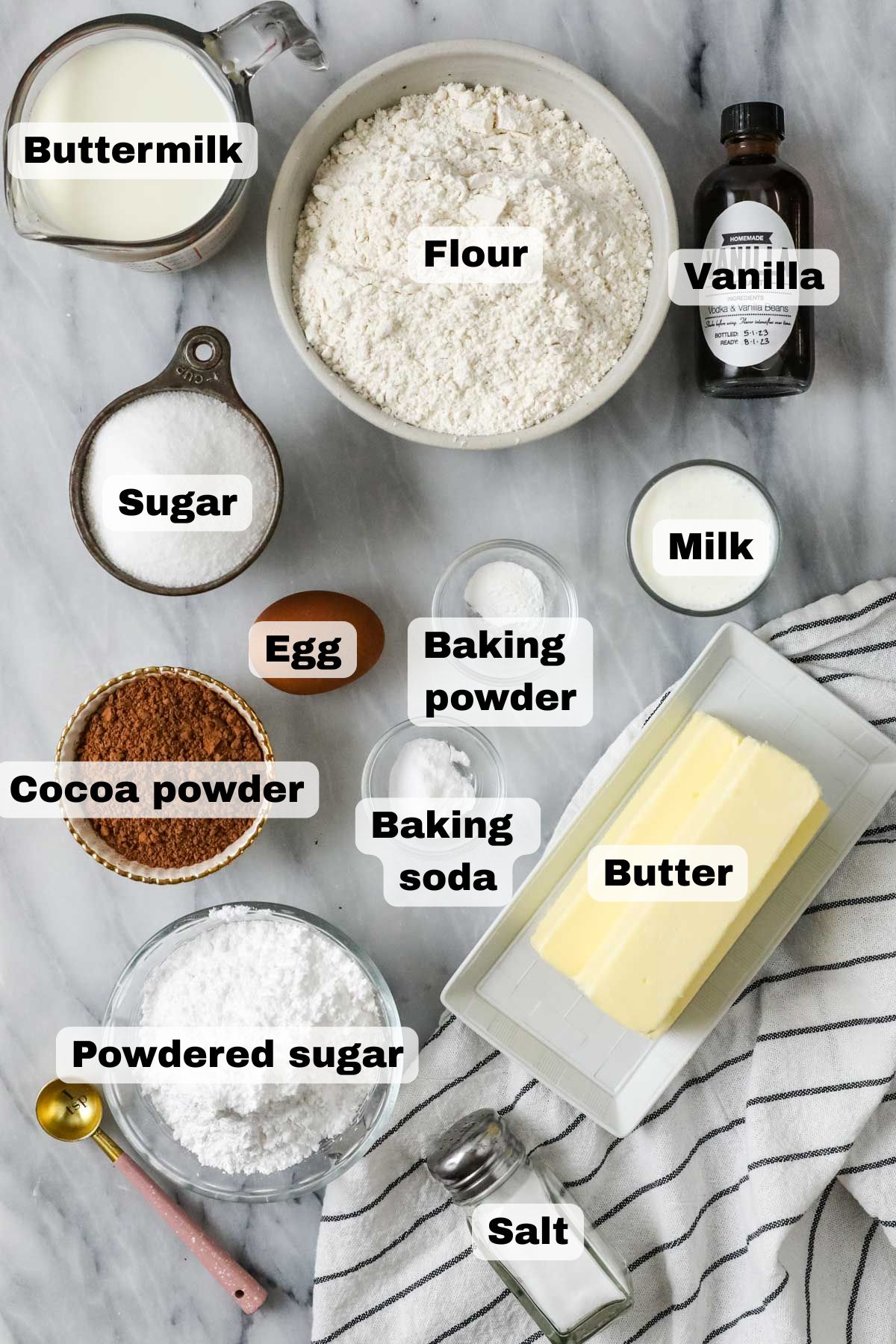 Overhead view of ingredients including cocoa powder, buttermilk, butter, and more.