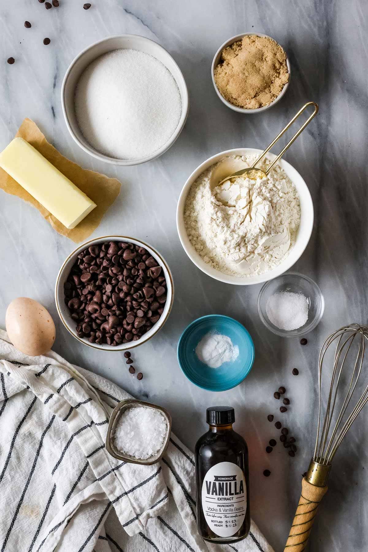 Elevated landscape of ingredients including flour, baking soda, butter, etc.