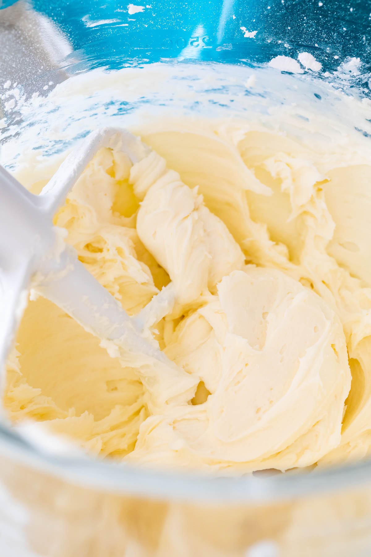 Close-up view of fluffy buttercream frosting after whipping in heavy cream.