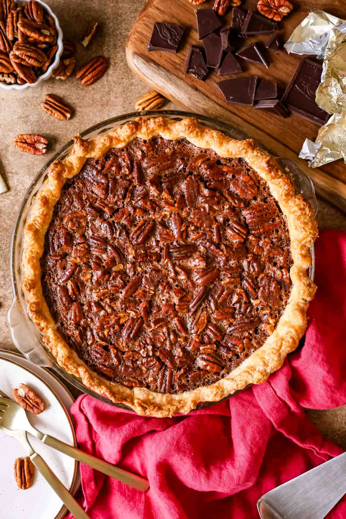 Overhead view of a chocolate pecan pie after baking.