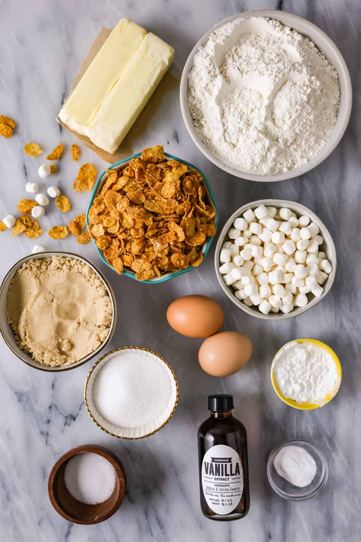 Overhead view of ingredients including cornflakes, mini marshmallows, brown sugar, and more.