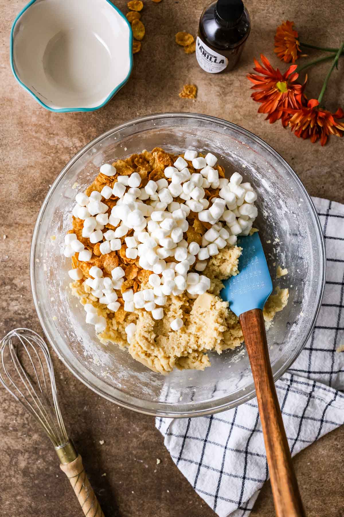 Overhead view of a bowl of cookie dough before mixing in cornflakes and marshmallows.