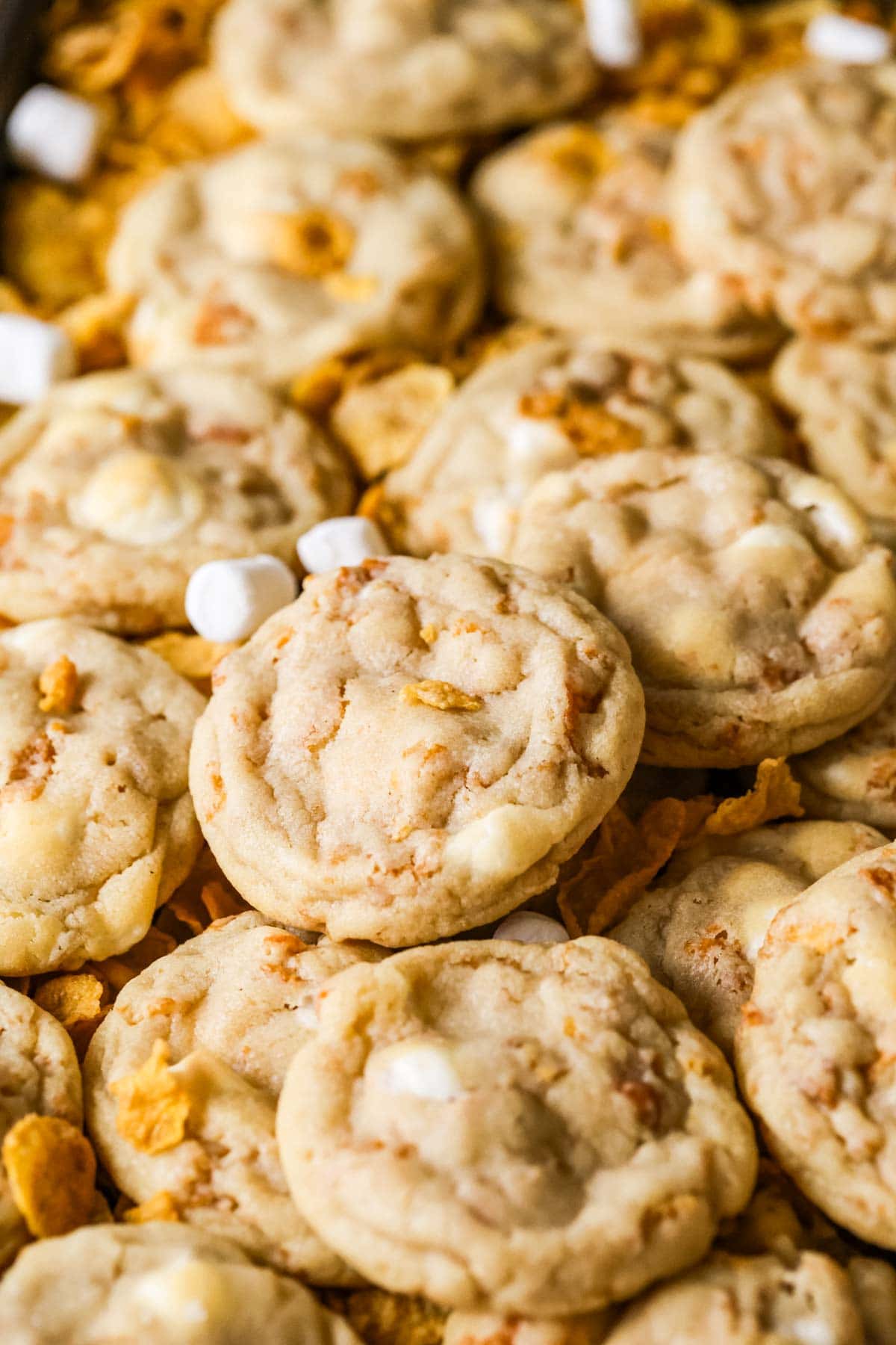 Close-up view of cornflake cookies made with toasted cornflakes and mini marshmallows.