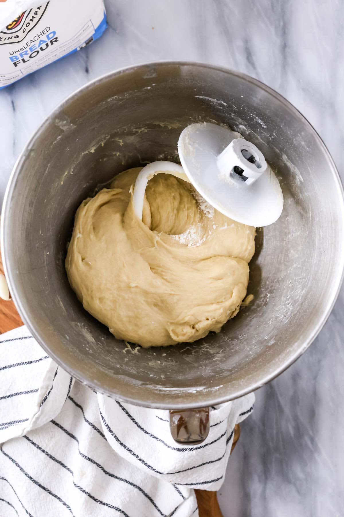 Overhead view of dough after kneading with a dough hook.