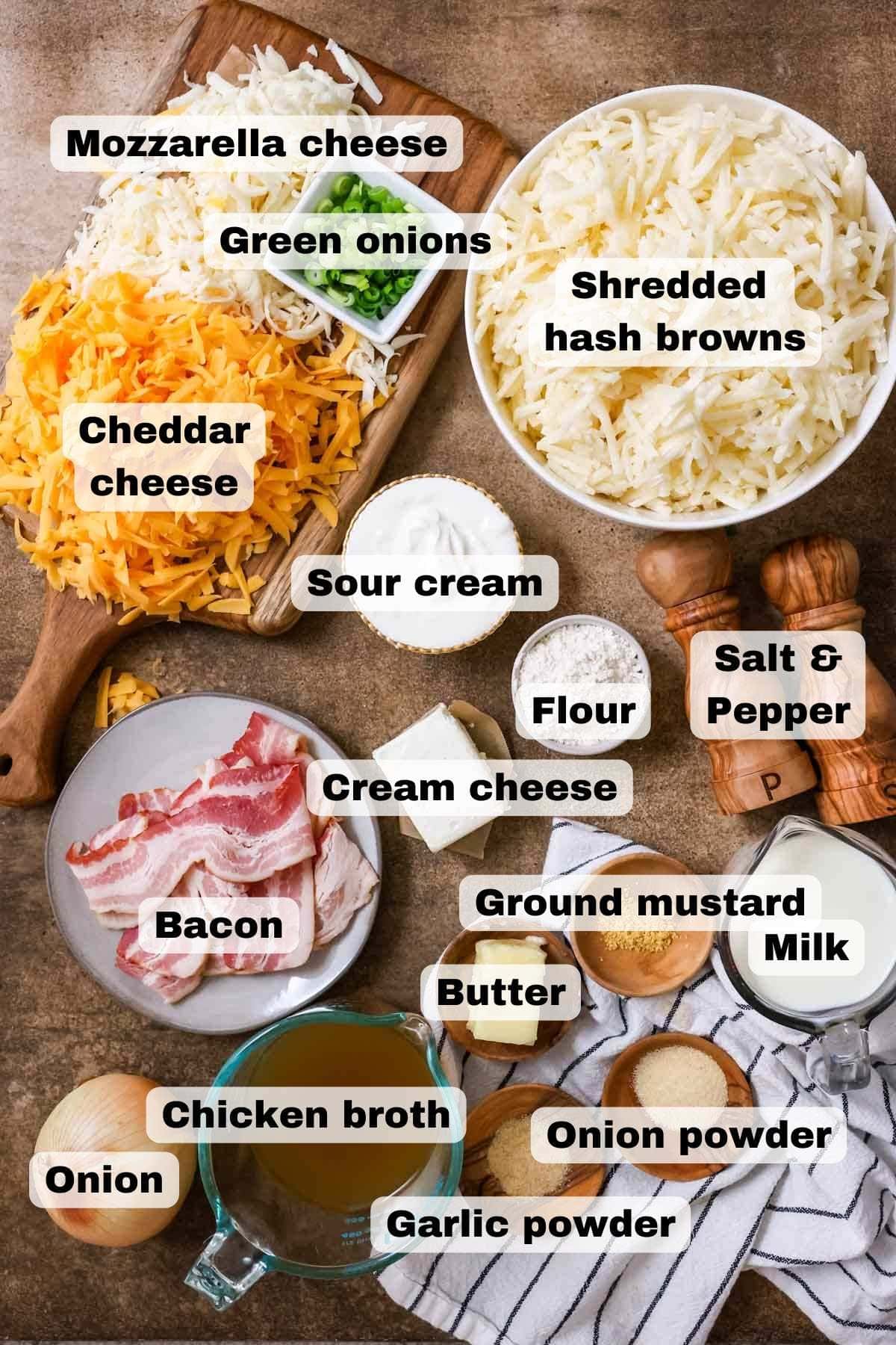 Overhead view of ingredients including cheese, hash brown potatoes, bacon, and more.