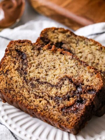 Two slices of nutella banana bread on a plate.