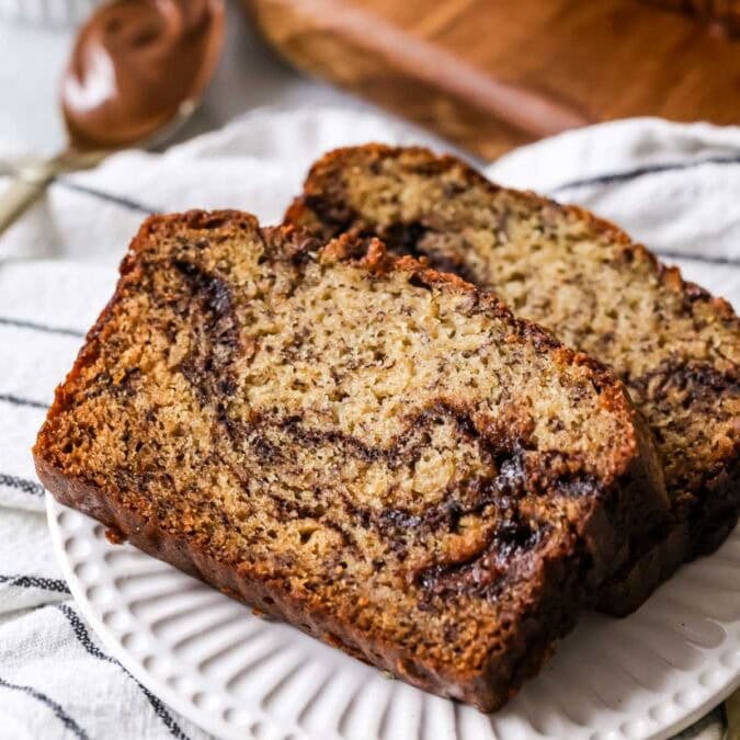 Two slices of nutella banana bread on a plate.