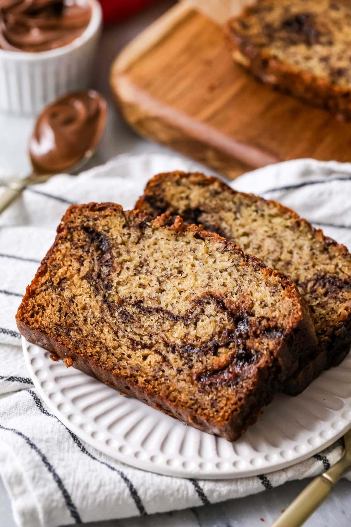 Two slices of nutella banana bread on a plate.