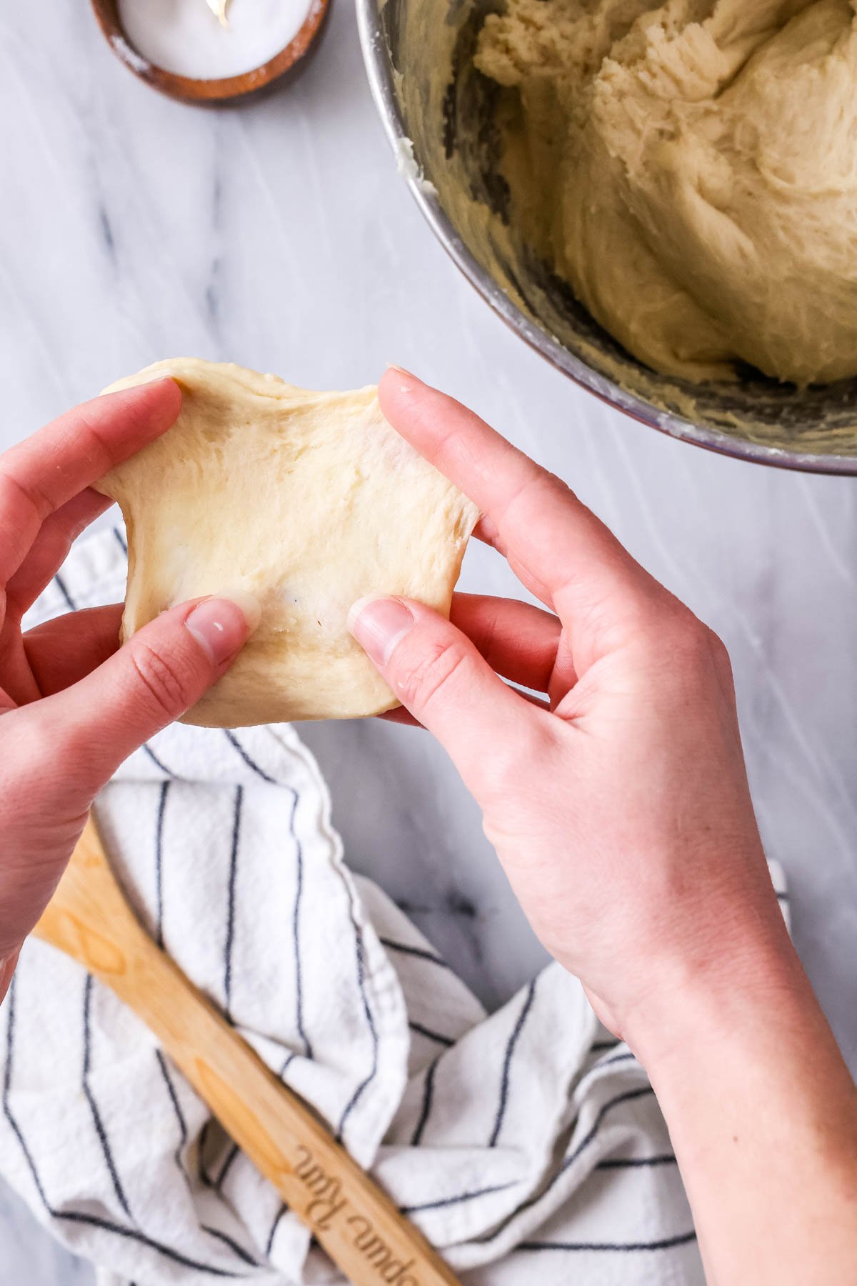 Windowpane test when making cinnamon rolls -- stratching a piece of dough until it's thin enough to see light through.