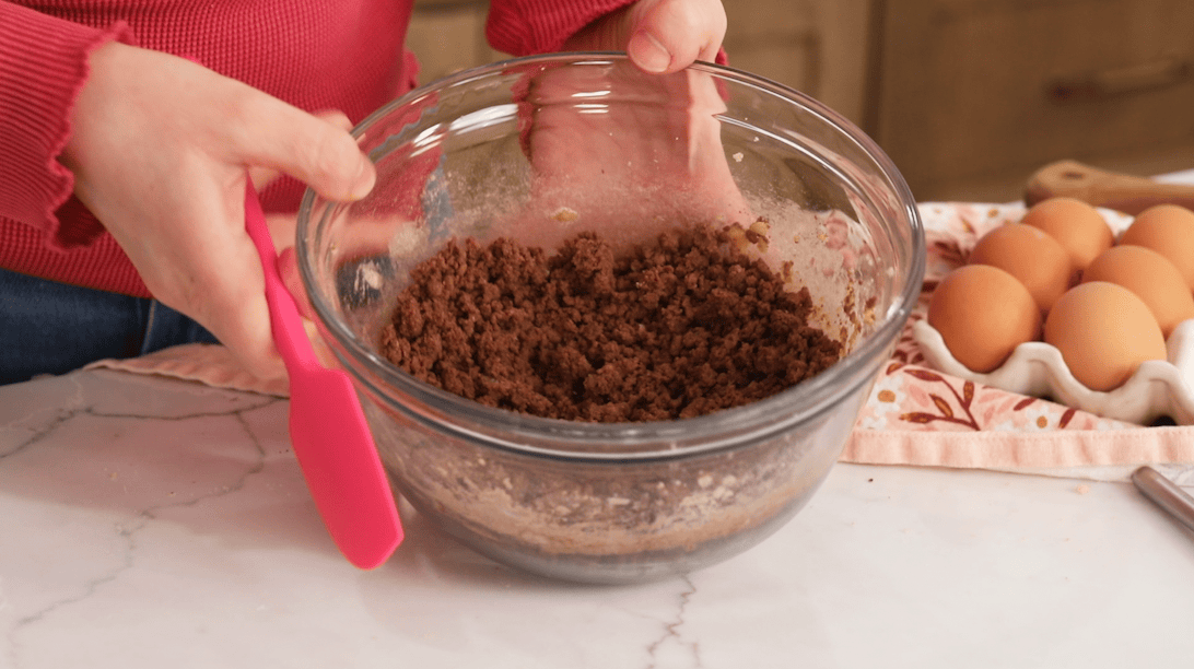Crumbly chocolate craquelin dough in a bowl.