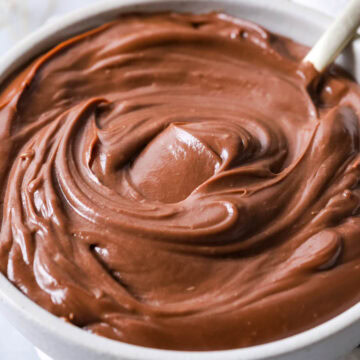 Bowl of chocolate pastry cream thats been stirred into a thick swirl.
