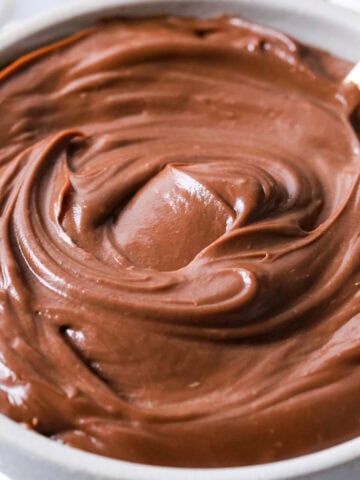 Bowl of chocolate pastry cream thats been stirred into a thick swirl.