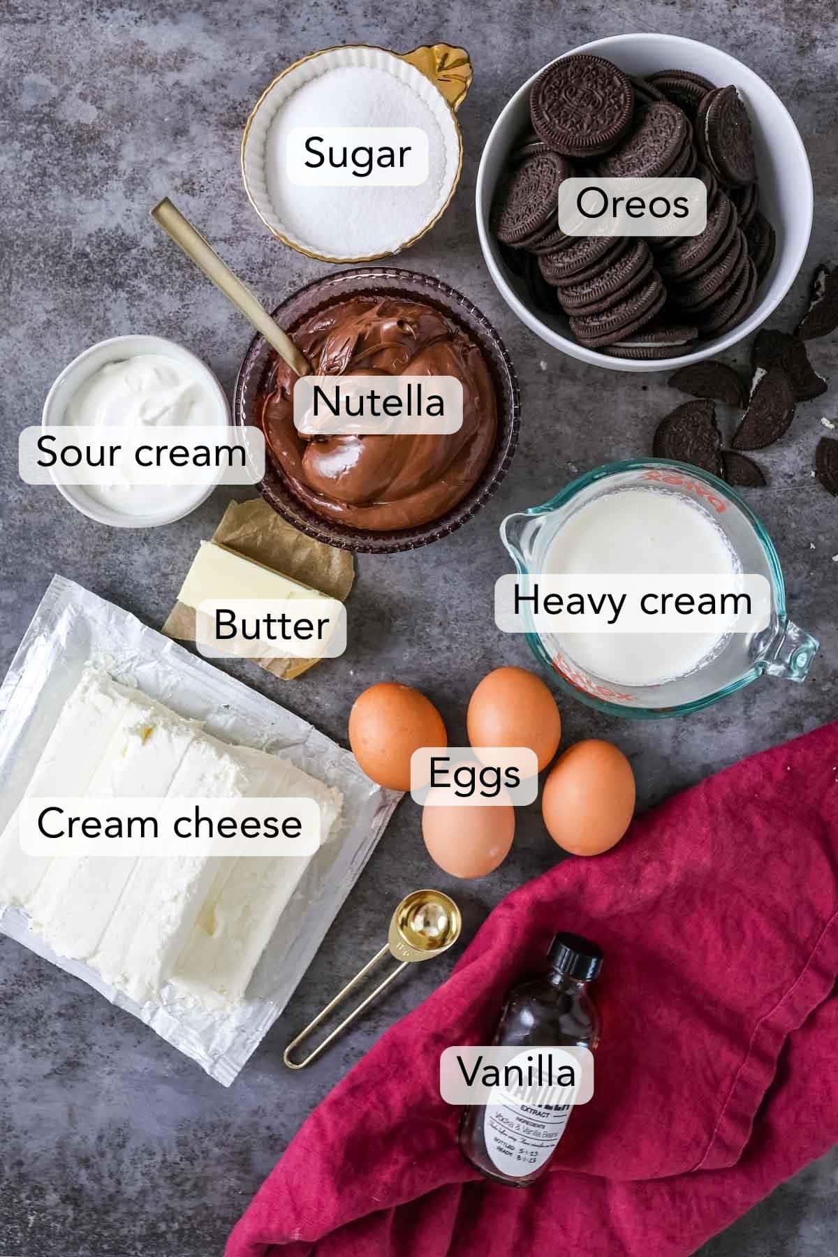 Overhead view of ingredients including cream cheese, Nutella, Oreos, and more.