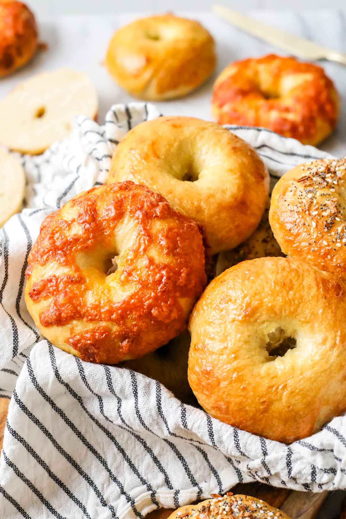 Close-up view of sourdough bagels of vary flavors, including plain, cheese, and everything.