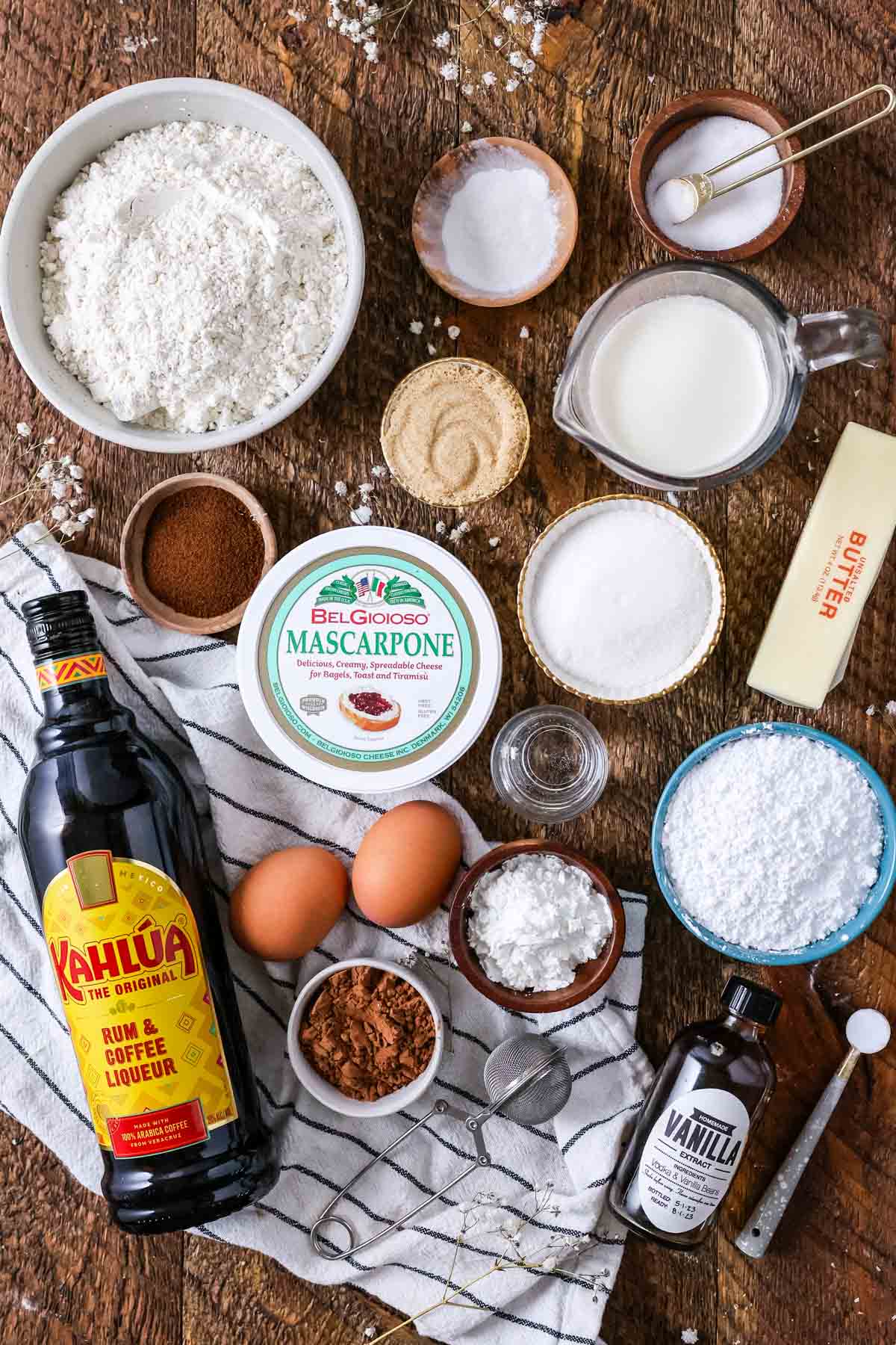 Overhead view of ingredients including mascarpone, kahlua, cocoa powder, and more.