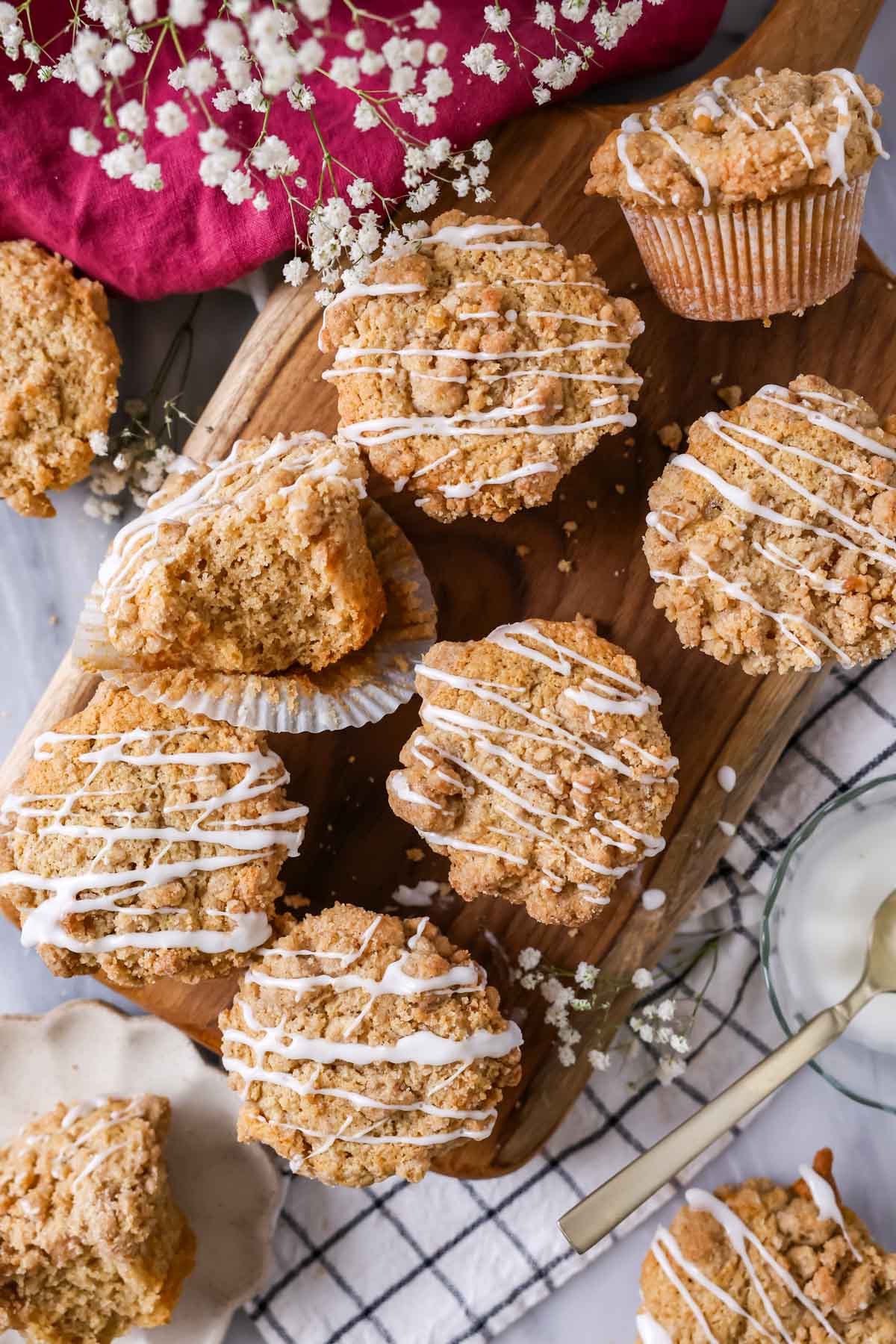 Overhead view of coffee cake muffins with a vanilla drizzle overtop.
