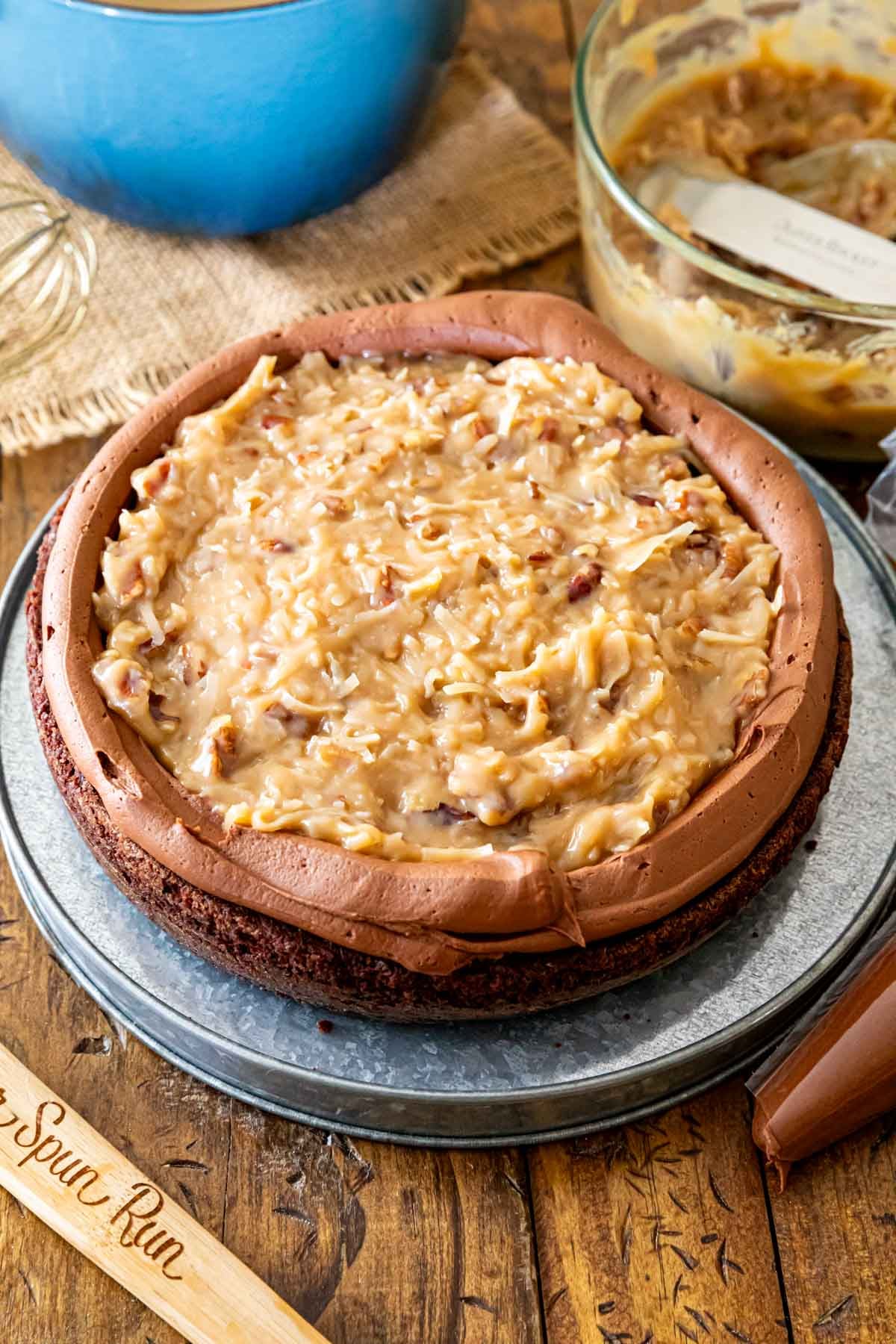 One layer of chocolate cake topped with a chocolate frosting dam and a coconut caramel filling.