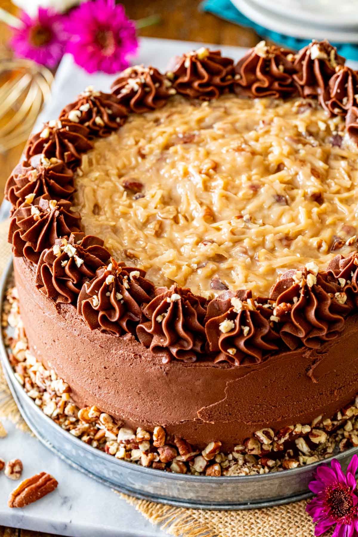 German chocolate cake frosted with a combination of coconut caramel frosting and chocolate frosting.