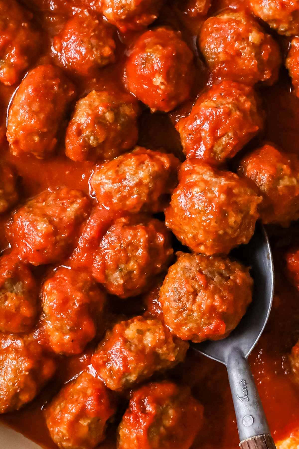Close-up view of meatballs in sauce.