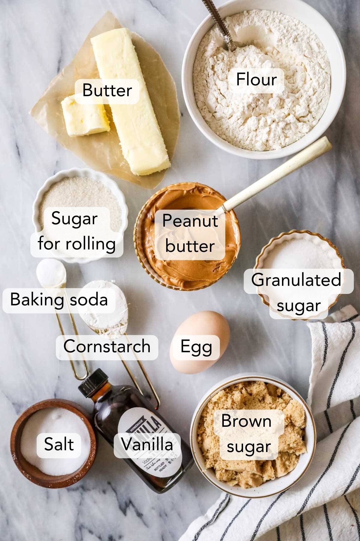 Overhead view of ingredients for my peanut butter cookie recipe including peanut butter, flour, eggs, and more.