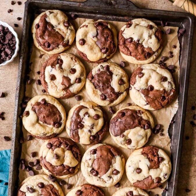 Overhead view of brookie cookies on a baking sheet.