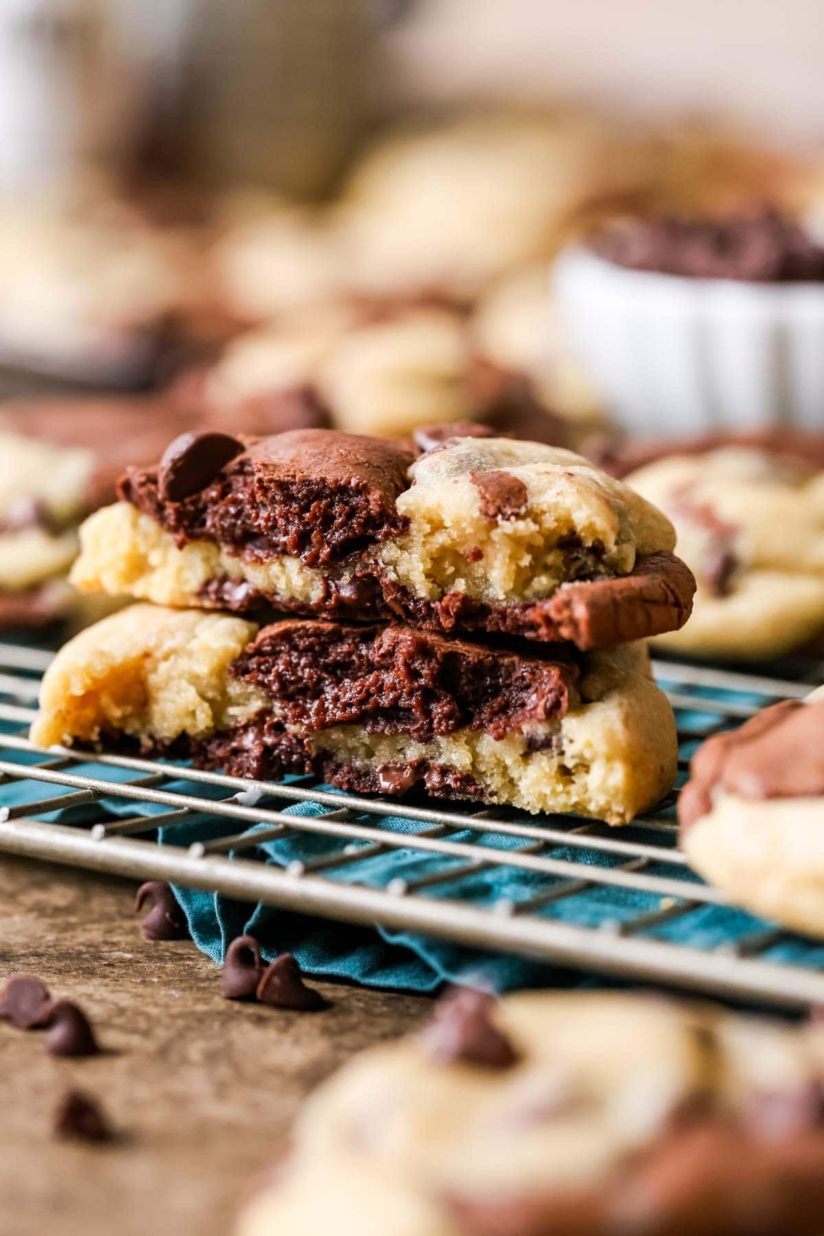 Two halves of a brookie cookie stacked on top of each other to show the distinct brownie and cookie layers.