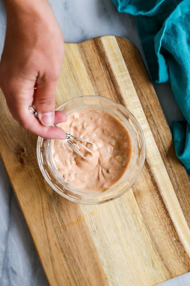Burger sauce being whisked together.