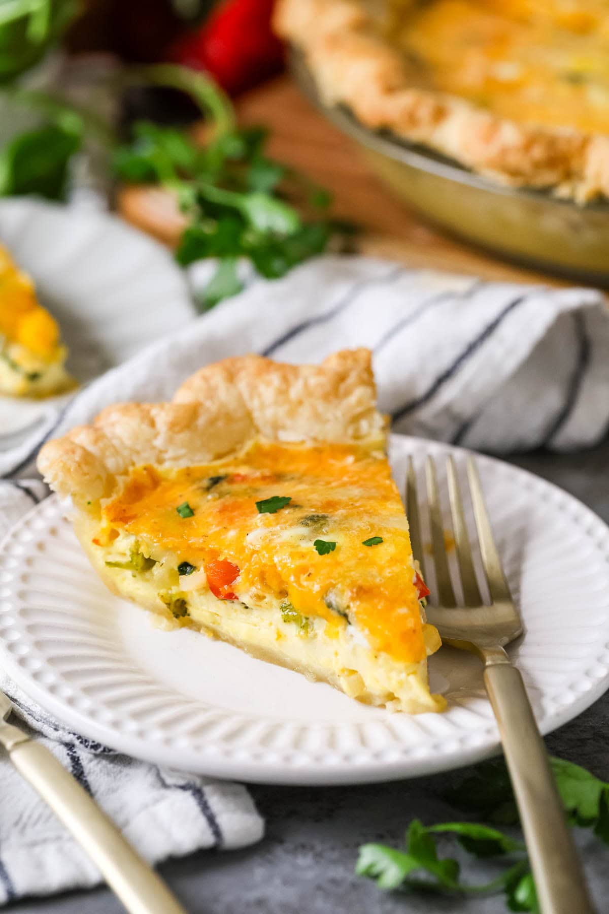 Slice of quiche on a plate.