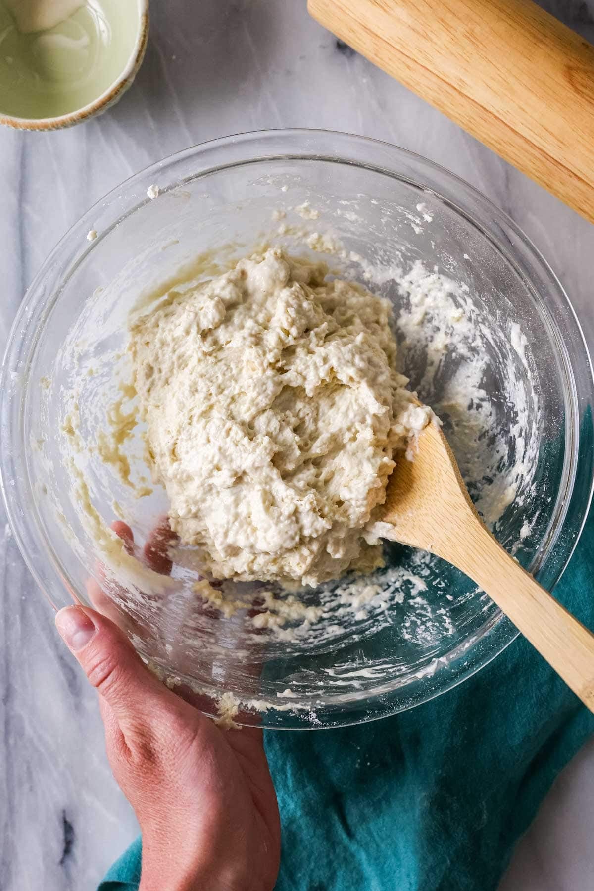 Bowl of sticky dough after adding water.
