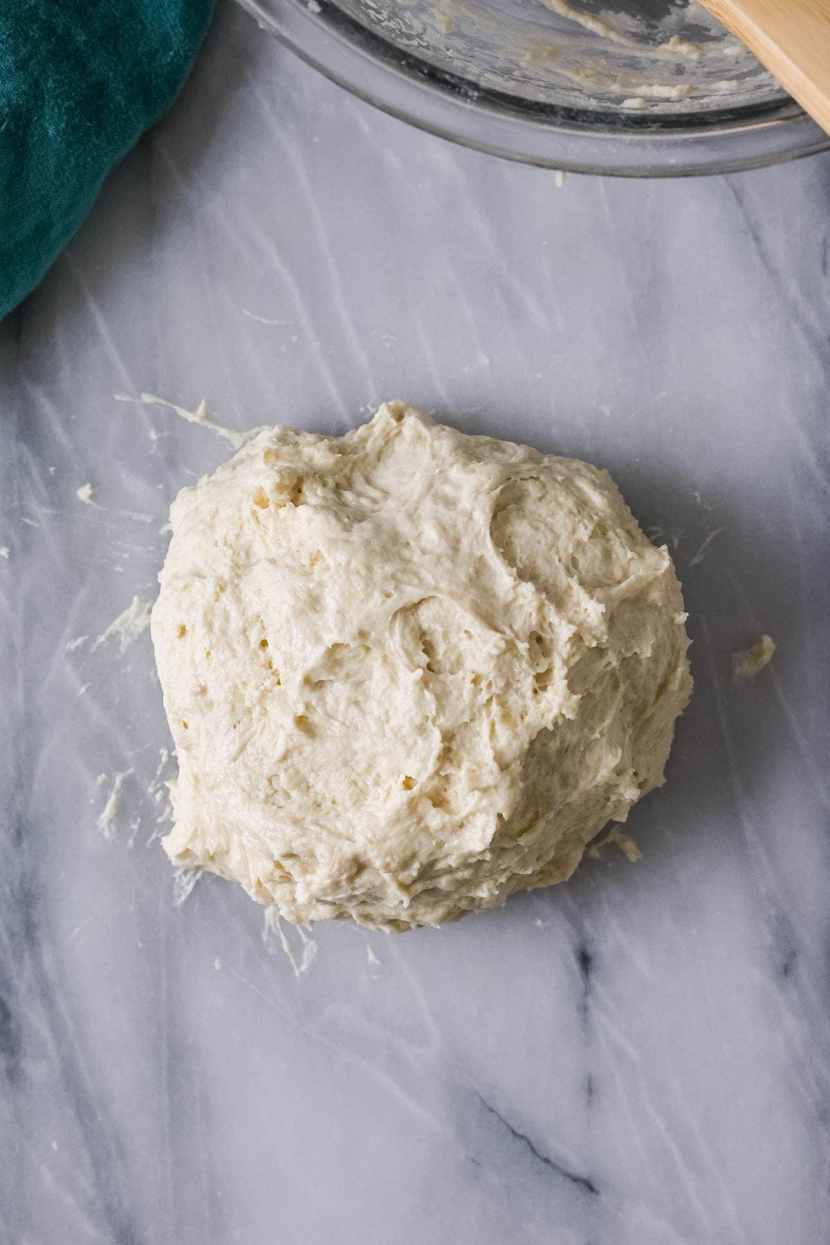 Tacky dough ball after kneading.