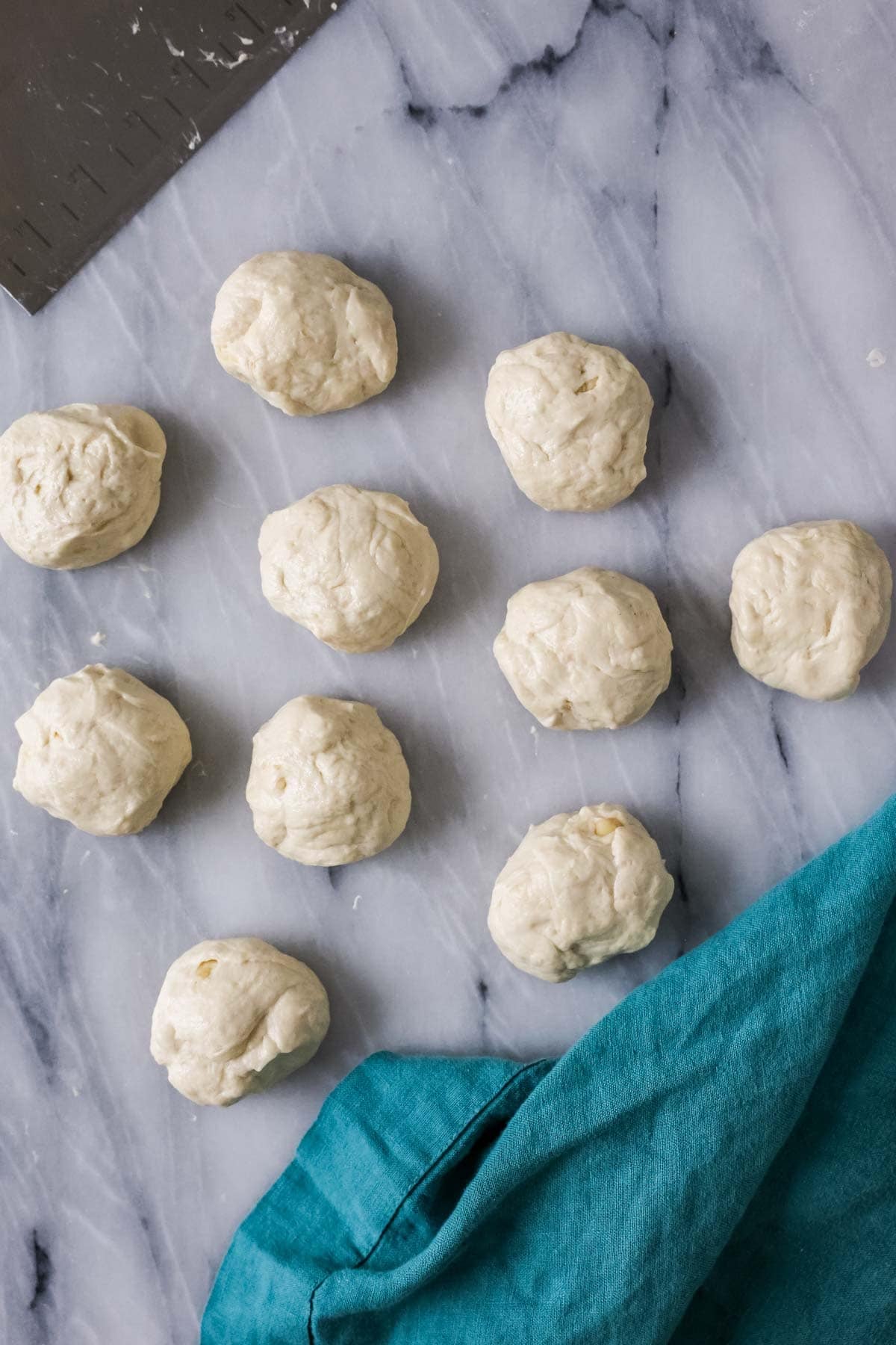 Overhead view of dough balls before rolling into tortillas.