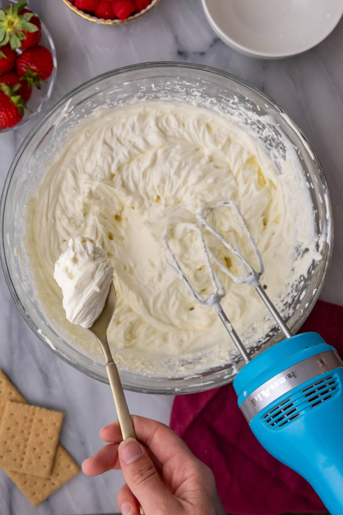 Overhead view of a thick and fluffy cream cheese mixture after whipping.
