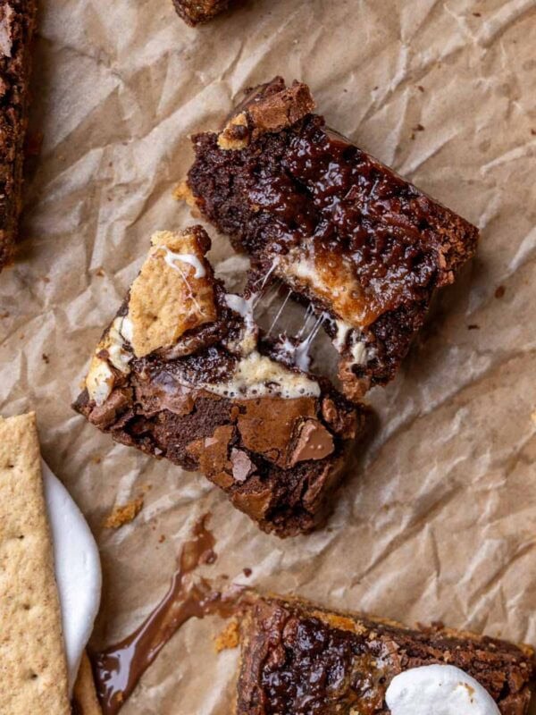 Overhead view of a s'mores brownie that's been broken in half to show a gooey center.