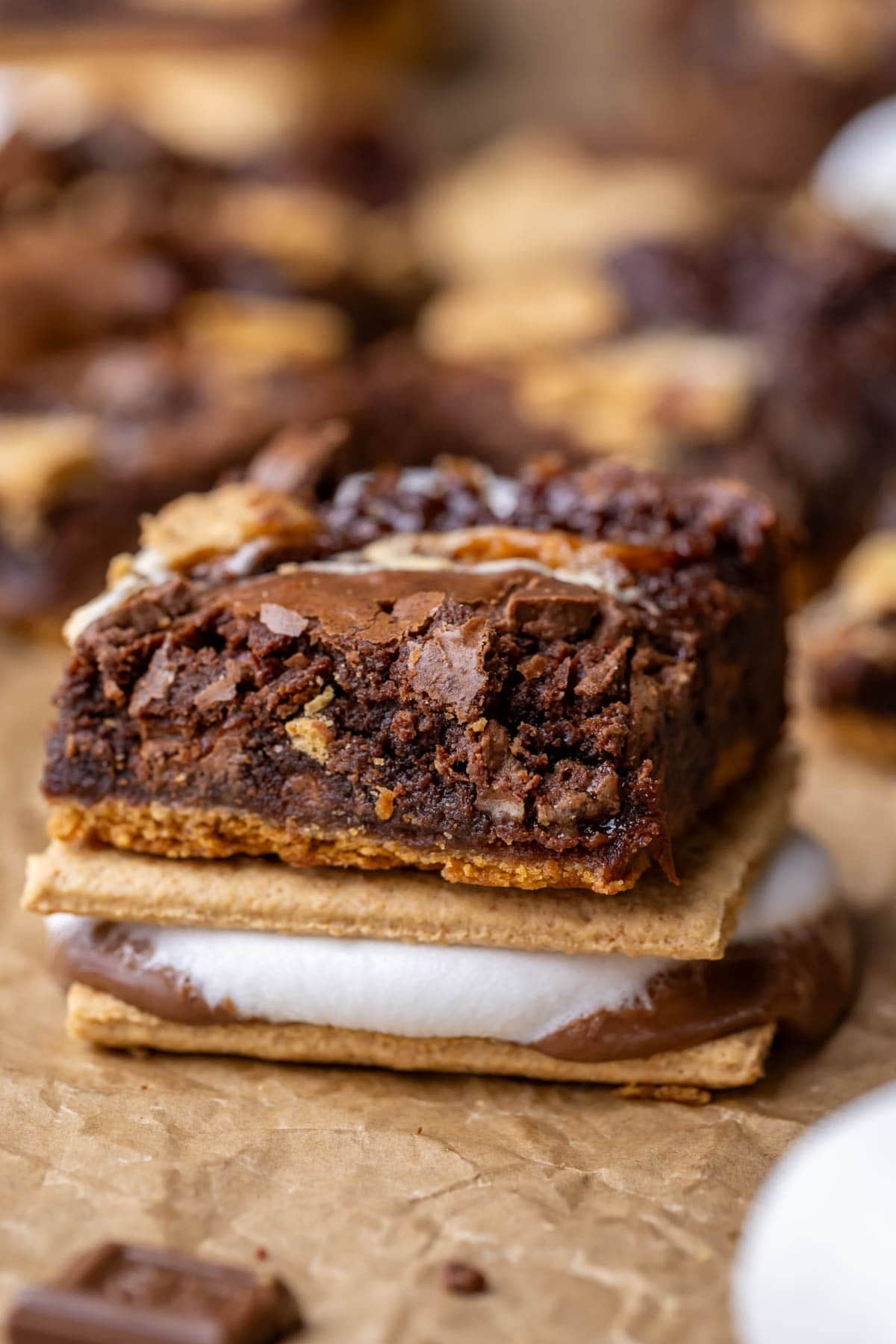 Close-up view of a s'mores brownie on top of a s'more.