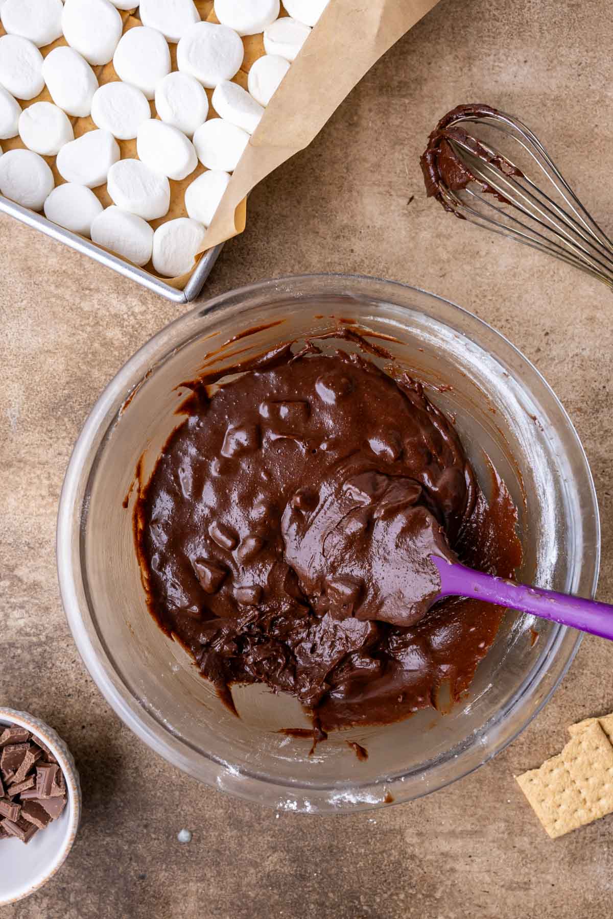 Overhead view of a glossy brownie batter in a bowl.