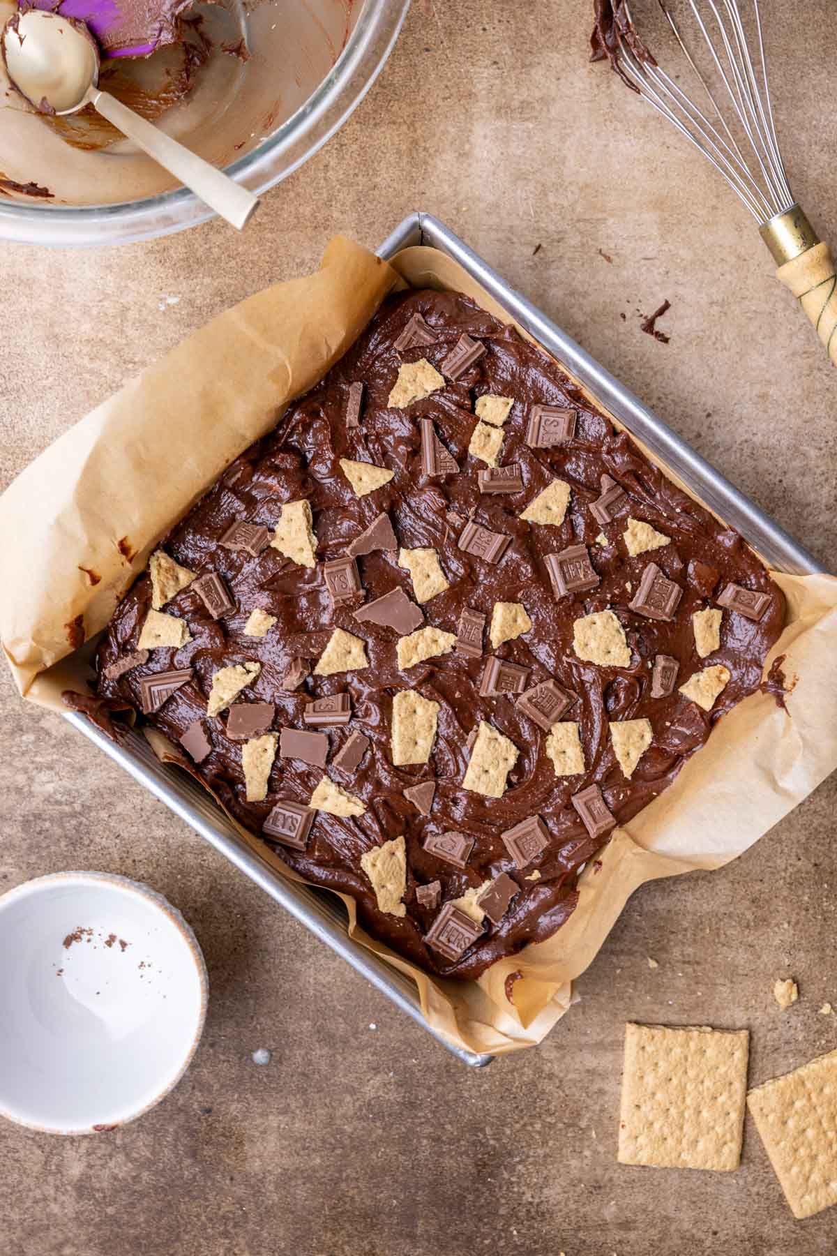 Overhead view of a pan of smores brownies before baking.
